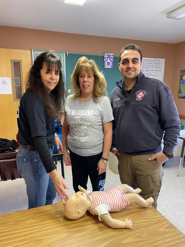 EMS Division Lieutenant and American Heart Association Instructor Kathy Hickman, along with EMS Division Lieutenant Barbara Oakes and EMS Division Lieutenant Brandon Kane prepare to teach a recent AED/CPR class. 