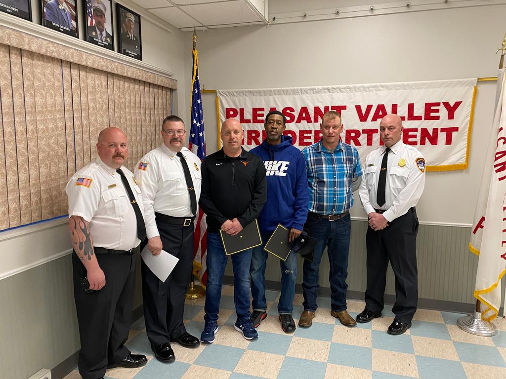 1st Assistant Chief Mark Luby and District Chief Mike Cosenza on left and 2nd Assistant Chief John Cronk on right presented the awards to the three civilians.