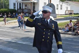 2nd Assistant Chief John Cronk proudly leads the department down Main Street. 