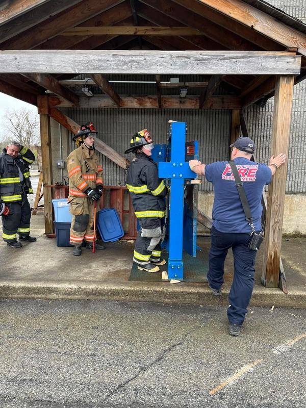 MTO Tom Murphy overseeing the probationary firefighters working on their forcible entry skills. 