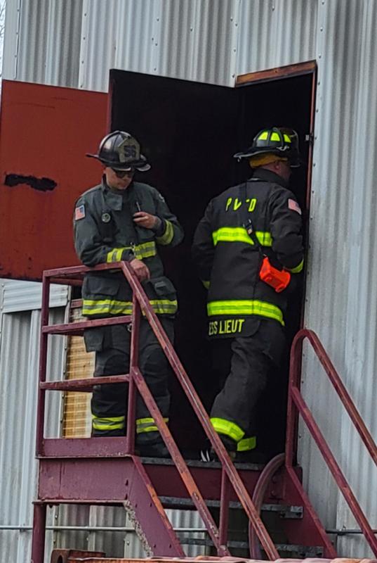 ESS Captain Trevor Simoni and ESS Lieutenant Ken Wallace watch and check on the members inside the building. 