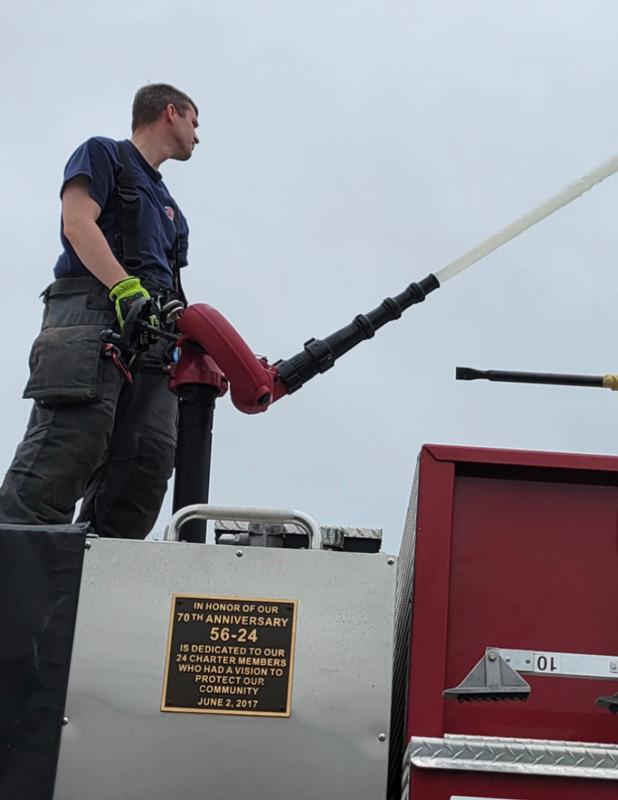 Firefighter Pat McKeever operates the deck gun on Engine 56-24. 