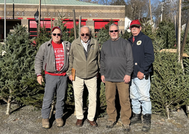 Butch Cronk, Floyd Gaddis, John Murphy and Rich Berger, our four 50-year members,
got together on the Fire Company’s Christmas Tree lot for a group photo.