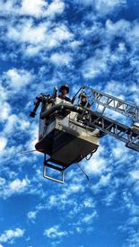 Captain Eddie See checking the operations of Ladder 56-45